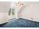 Attic bedroom featuring blue carpet, ceiling fan and a window for plenty of light at 2682 Varner Dr, Atlanta, GA 30345