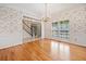 Dining room with hardwood floors, chandelier, and an open view to other rooms in the home at 2682 Varner Dr, Atlanta, GA 30345