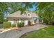 Charming single-Gathering home features a well-manicured lawn, mature trees, and a paved driveway at 2682 Varner Dr, Atlanta, GA 30345