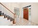 Inviting home foyer with a staircase, tiled floors, and a glimpse into the living area at 2682 Varner Dr, Atlanta, GA 30345