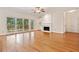 Spacious living room featuring hardwood floors, large windows, and a cozy fireplace at 2682 Varner Dr, Atlanta, GA 30345