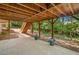 Back patio with wooden support beams, trees, and access to a backyard oasis at 2682 Varner Dr, Atlanta, GA 30345