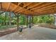 Covered back patio for entertaining offers a serene backyard view and convenient access to the outdoors at 2682 Varner Dr, Atlanta, GA 30345