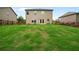 Green backyard with a wood fence providing privacy and space at 4650 Pleasant Woods Dr, Cumming, GA 30028