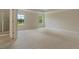 Serene primary bedroom with plush carpeting and abundant natural light, offering a relaxing retreat at 4650 Pleasant Woods Dr, Cumming, GA 30028