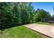 Lush backyard with grass and trees, offering a private outdoor space for relaxation and recreation at 118 Woodhouse Cir, Acworth, GA 30102