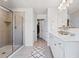 Spacious bathroom with a walk-in shower and double vanity sinks at 118 Woodhouse Cir, Acworth, GA 30102