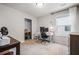 Bright bedroom features neutral walls, a window, and a dedicated workspace with desk and storage at 118 Woodhouse Cir, Acworth, GA 30102