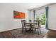 Cozy dining area featuring a wooden American flag wall art and natural light at 118 Woodhouse Cir, Acworth, GA 30102