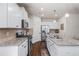 Well-lit kitchen with stainless steel appliances and ample cabinet space at 118 Woodhouse Cir, Acworth, GA 30102