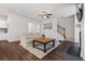 Open-concept living area with hardwood floors and a cozy fireplace at 118 Woodhouse Cir, Acworth, GA 30102