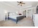 Bright main bedroom boasts a neutral color scheme and a ceiling fan at 118 Woodhouse Cir, Acworth, GA 30102