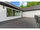 Private deck with dark wood flooring and views of the green backyard at 1604 Greendale Rd, Covington, GA 30014