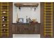 Stylish bar area with custom shelving, under cabinet lighting, and wood paneled accents at 1604 Greendale Rd, Covington, GA 30014