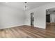 Clean and bright bedroom with hardwood floors and modern lighting at 1604 Greendale Rd, Covington, GA 30014