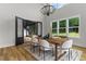 Dining room with wood table, backyard views, and an outdoor deck accessible through glass doors at 1604 Greendale Rd, Covington, GA 30014