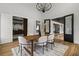 Bright dining room with wood table, bar area with wine storage, and backyard access through glass doors at 1604 Greendale Rd, Covington, GA 30014