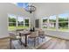 Dining area with large windows offering bright natural light and views of the backyard at 1604 Greendale Rd, Covington, GA 30014