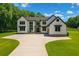 Stunning two-story modern farmhouse with sleek black accents and an expansive front yard at 1604 Greendale Rd, Covington, GA 30014