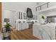 Bright kitchen featuring marble counters, a spacious island, and stainless steel appliances at 1604 Greendale Rd, Covington, GA 30014
