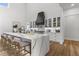 Open kitchen with large island, seating, marble counters and modern appliances at 1604 Greendale Rd, Covington, GA 30014