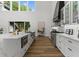 Modern kitchen with marble countertops, custom cabinetry, and stainless steel appliances at 1604 Greendale Rd, Covington, GA 30014
