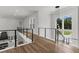 View from the hall to the chef's kitchen with stainless appliances and a kitchen island at 1604 Greendale Rd, Covington, GA 30014