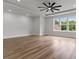 Bright, open living room with hardwood floors, recessed lights, and ceiling fan at 1604 Greendale Rd, Covington, GA 30014