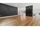 Open-concept living space with hardwood floors, a fireplace, and modern design at 1604 Greendale Rd, Covington, GA 30014