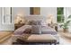 Comfortable main bedroom featuring a neutral color palette and wood flooring at 1604 Greendale Rd, Covington, GA 30014