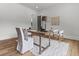 Simple office featuring light walls, wood desk, and neutral-toned chairs and décor at 1604 Greendale Rd, Covington, GA 30014