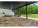 Outdoor patio with stone flooring, ceiling fans, and backyard views at 1604 Greendale Rd, Covington, GA 30014