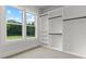 Spacious walk-in closet with built-in shelving and natural light from the window at 1604 Greendale Rd, Covington, GA 30014