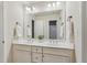 Clean, bright bathroom with double sinks, white cabinets and a large mirror at 1917 Oak Grove Ne Rd, Atlanta, GA 30345
