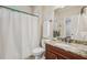 Full bathroom with granite countertops, a shower, and a white privacy curtain at 1917 Oak Grove Ne Rd, Atlanta, GA 30345