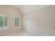 Bright bedroom with neutral walls, carpet, and shuttered windows at 1917 Oak Grove Ne Rd, Atlanta, GA 30345