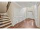 Inviting foyer with hardwood floors, staircase, and natural light streaming through the front door at 1917 Oak Grove Ne Rd, Atlanta, GA 30345