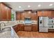 Well-equipped kitchen with granite countertops, stainless steel appliances, and wood cabinetry at 1917 Oak Grove Ne Rd, Atlanta, GA 30345