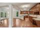 Open-concept kitchen with granite countertops, stainless steel appliances, and access to outdoor patio at 1917 Oak Grove Ne Rd, Atlanta, GA 30345