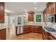 Stylish kitchen featuring granite countertops, stainless steel appliances, and wood cabinets at 1917 Oak Grove Ne Rd, Atlanta, GA 30345