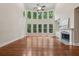 Bright living room features high ceilings, fireplace, and wall of windows at 1917 Oak Grove Ne Rd, Atlanta, GA 30345