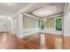 Open concept living room featuring decorative trim, and hardwood floors at 1917 Oak Grove Ne Rd, Atlanta, GA 30345