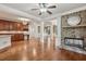 Bright living room featuring hardwood floors, brick fireplace, and decorative columns at 1917 Oak Grove Ne Rd, Atlanta, GA 30345
