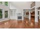 Bright living room with built-in shelves, a fireplace, and hardwood floors throughout at 1917 Oak Grove Ne Rd, Atlanta, GA 30345