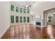 Bright living room with a fireplace, built-in shelves, and large windows offering scenic views at 1917 Oak Grove Ne Rd, Atlanta, GA 30345