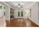 Open living area with brick fireplace, hardwood floors, and french doors to back deck at 1917 Oak Grove Ne Rd, Atlanta, GA 30345
