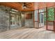Charming screened porch boasts brick accent wall and access to backyard views at 1917 Oak Grove Ne Rd, Atlanta, GA 30345