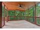 Relaxing screened porch features wood ceiling and lush outdoor views at 1917 Oak Grove Ne Rd, Atlanta, GA 30345