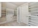 Spacious walk-in closet with ample shelving and well-organized storage solutions at 1917 Oak Grove Ne Rd, Atlanta, GA 30345