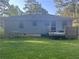Exterior view of the backyard showing a back deck and the house at 2530 Old Colony Rd, East Point, GA 30344